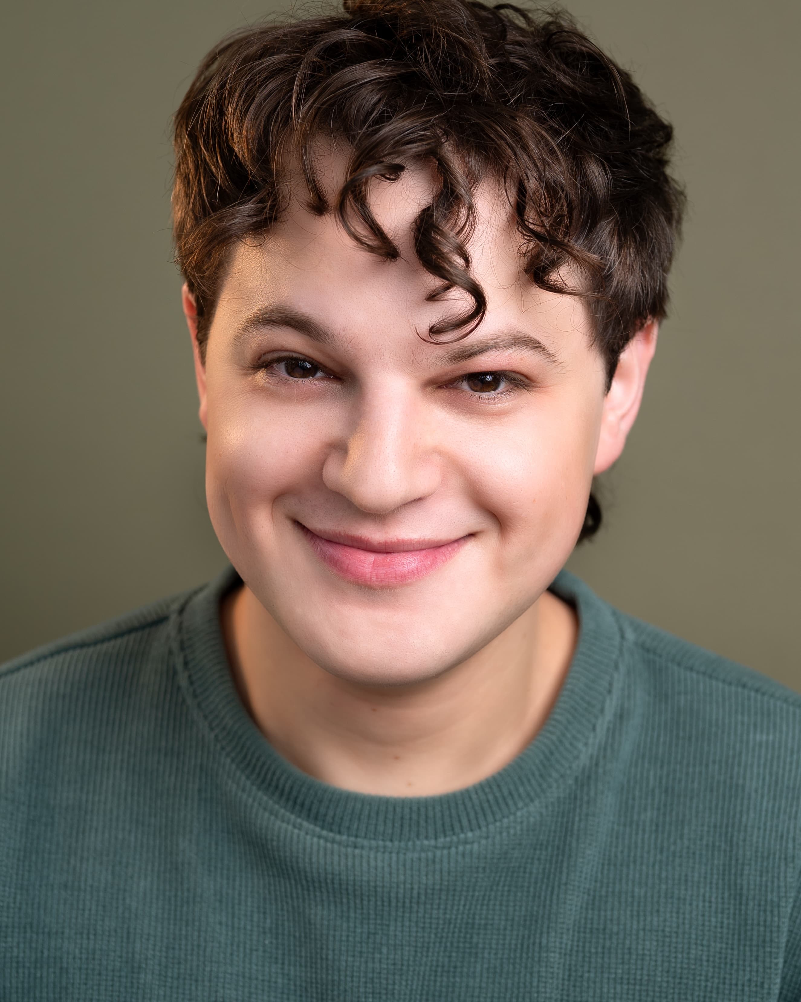 Jacob in denim jacket, kind smile.